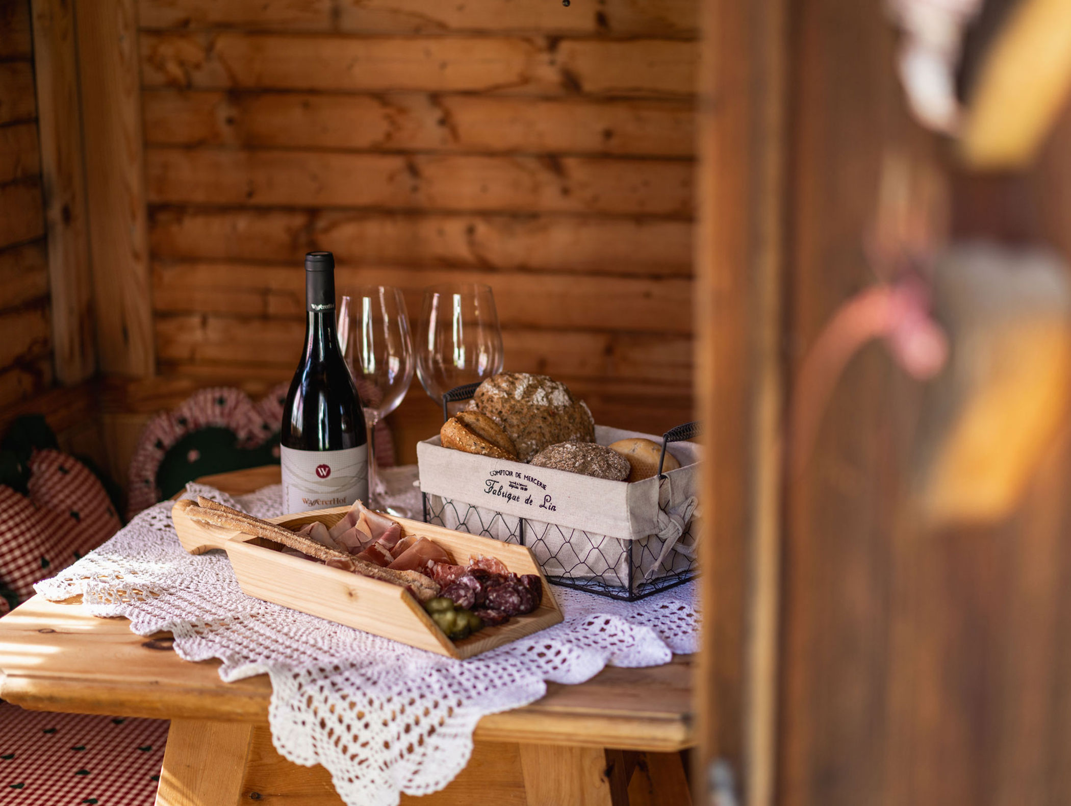 Snack with wine and glasses - Ariane's Guesthouse